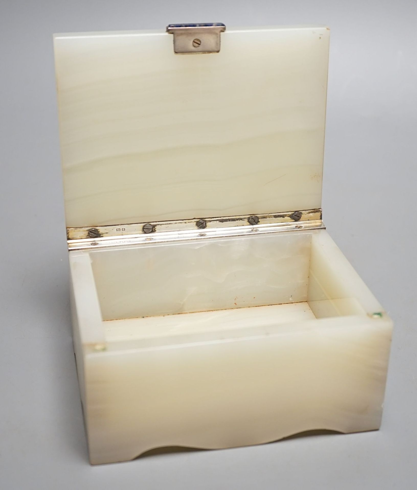 A silver mounted onyx cigarette case, 1947, retailed by Asprey